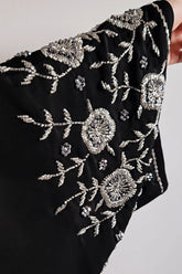 Black abaya with heavy silver embellishments on korean nida, open and closed