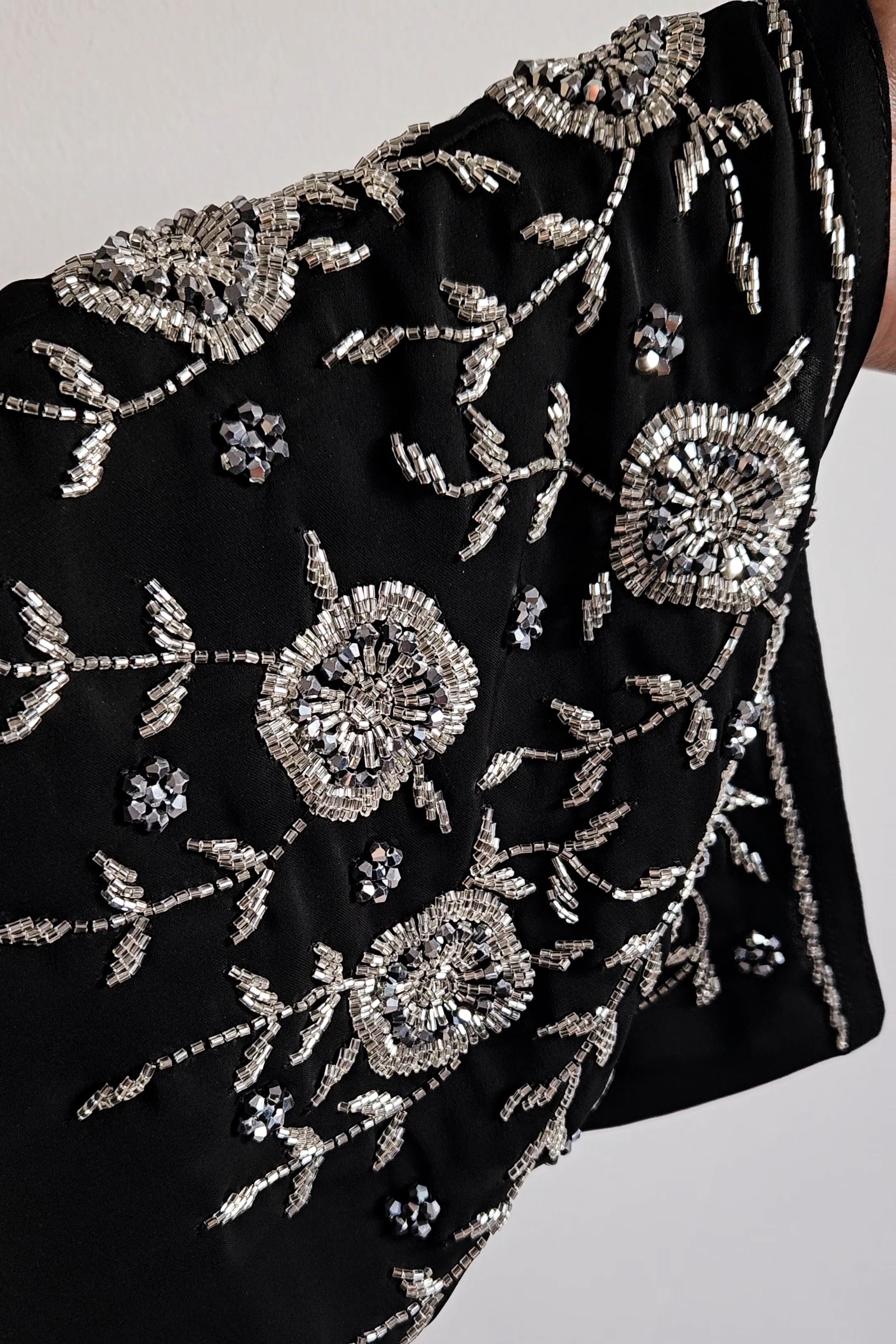 Black abaya with heavy silver embellishments on korean nida, open and closed